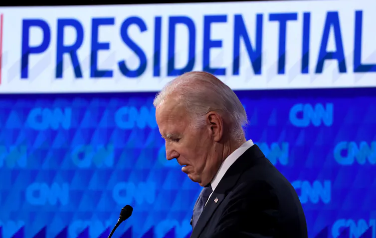 Biden in front of text reading 'presidential'.