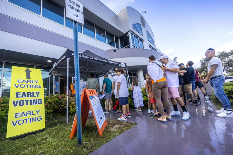 People wait in line to vote on Florida's last early voting day for the 2024 presidential election in Florida.