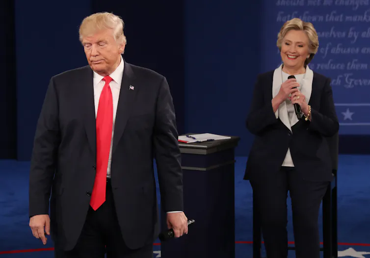 US presidential candiates Democrat Hillary Clinton (R) and Republican Donald Trump (L) during the second presidential debate at Washington University