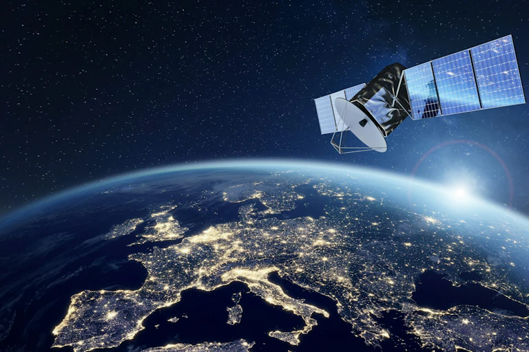 A satellite in space with Europe visible below