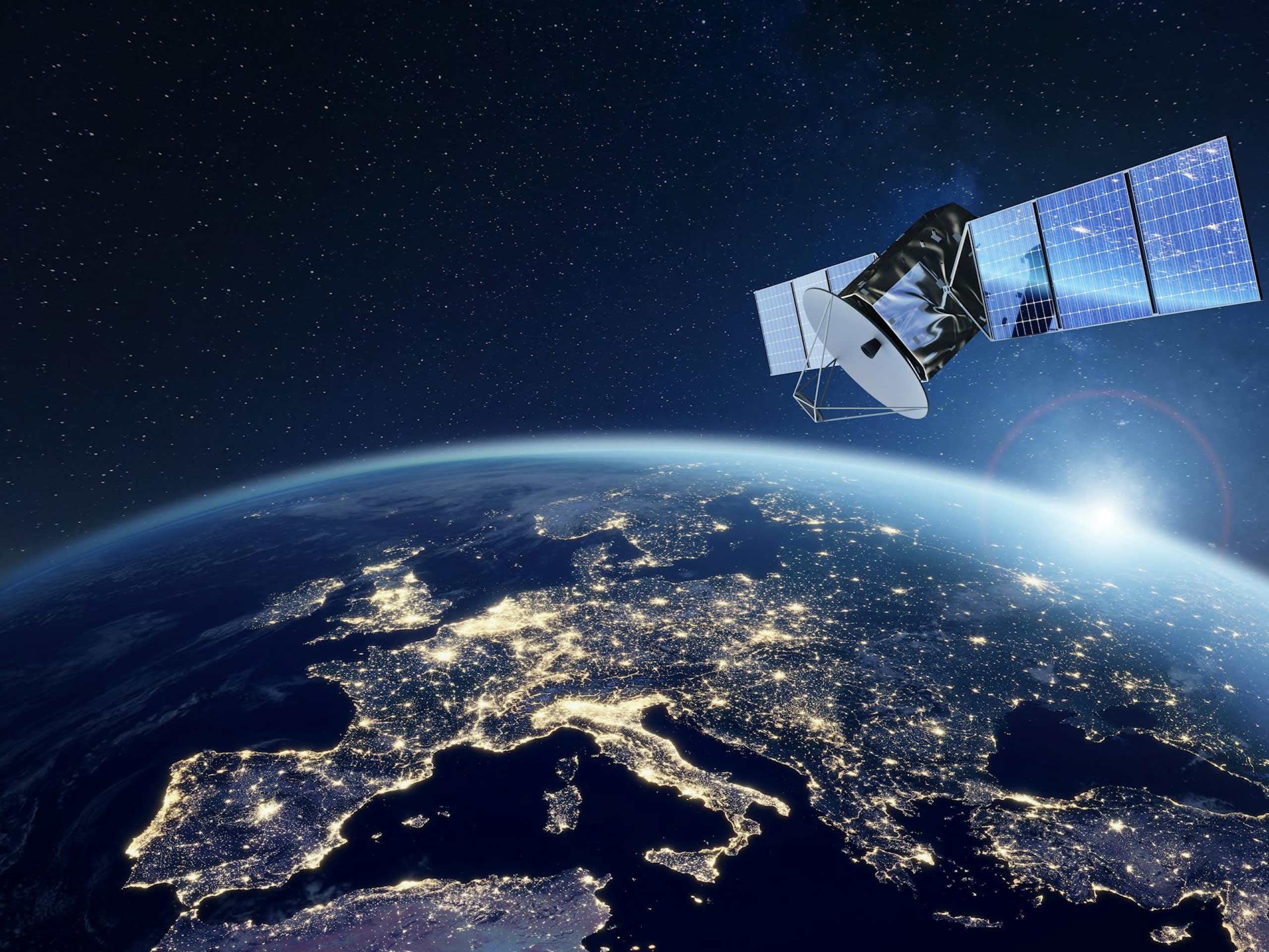 A satellite in space with Europe visible below