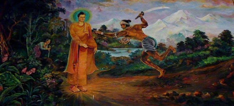 A painting showing a monk in saffron robes standing peacefully while a man holding a knife lunges toward him.