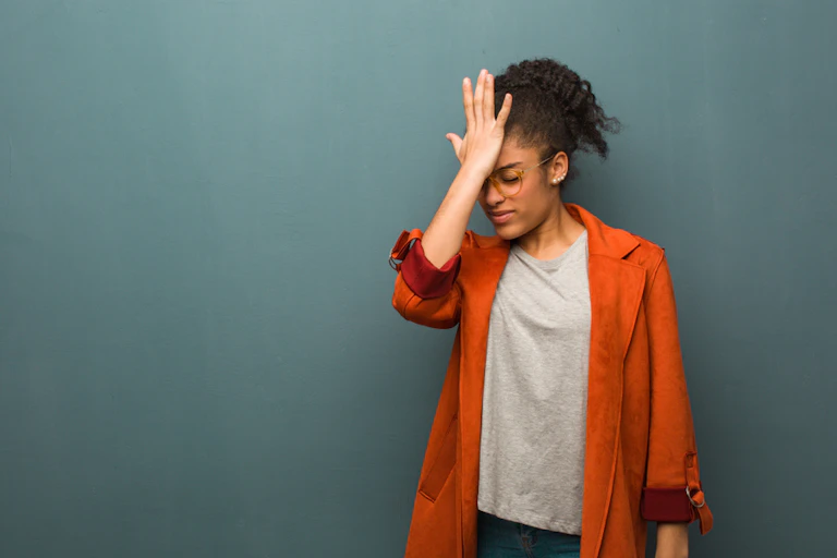 Woman slapping her head