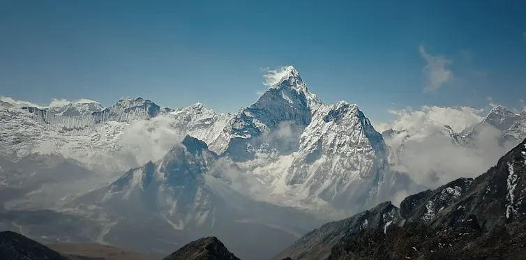 A very high mountain with a snow-capped peak