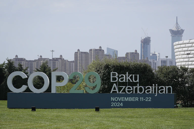 A sign says COP29 outside the conference centre in Baku.