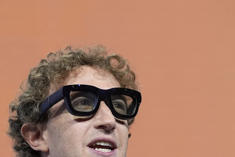 Man wearing large pair of glasses with black rims.