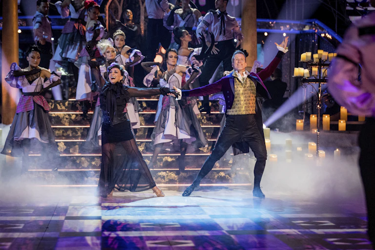 Dancers perform on stage
