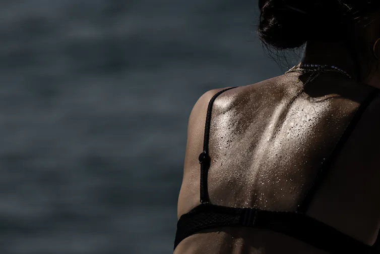 The back of a sweaty person.