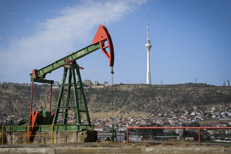A pumpjack operates at a suburban oil drilling site in Baku, Azerbaijan, Monday, Sept. 16, 2024