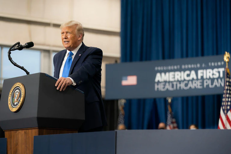Donald Trump at a podium.