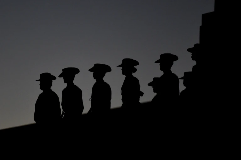 Servicewomen line up during a dawn service.