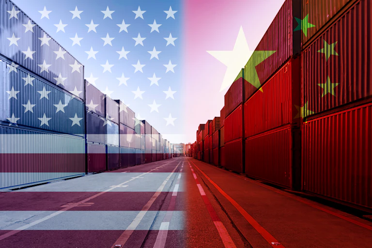 Shipping containers overlaid with graphics of the US flag and Chinese flag
