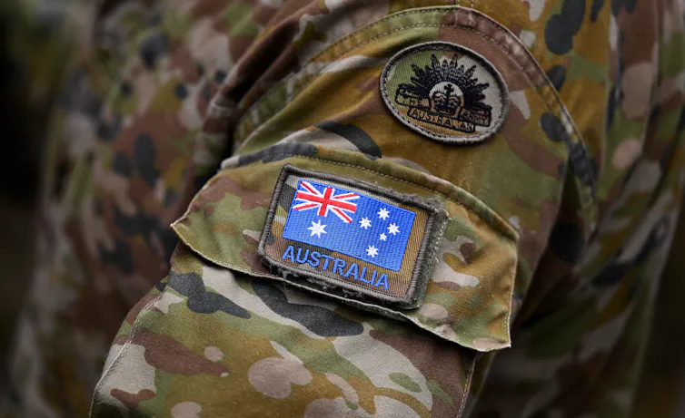 Detail of an Australian flag pictured on the uniform of Australian Army personnel