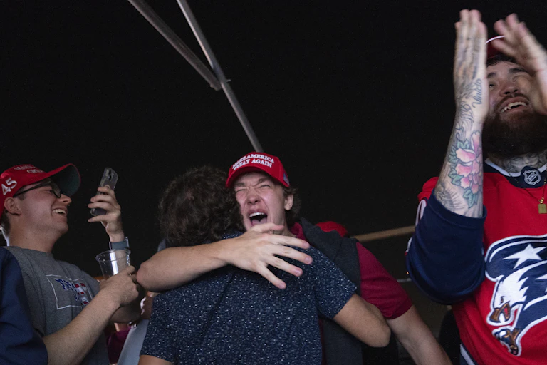 Trump supporters hug and celebrate