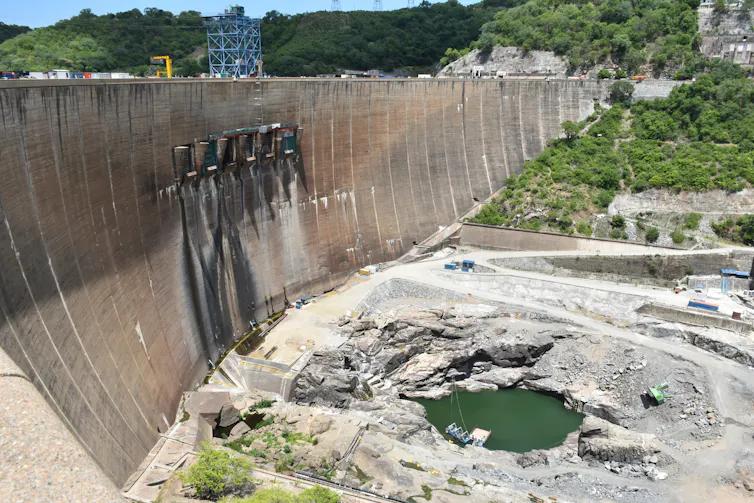 dam wall, dry below