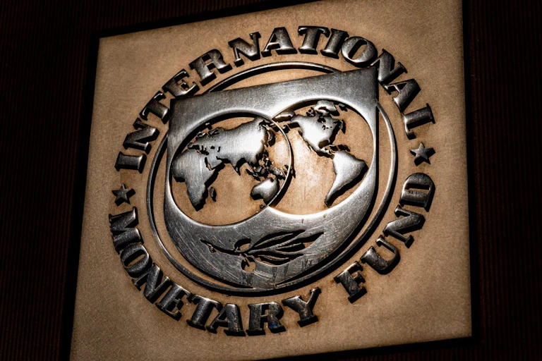 Logo of the International Monetary Fund, carved in wood