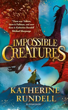 Book cover featuring a large red dragon and two people beneath.