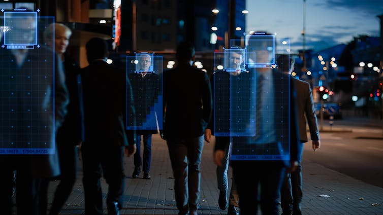 people walking on a sidewalk