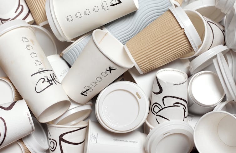 A stack of unrecyclable take away coffee cups