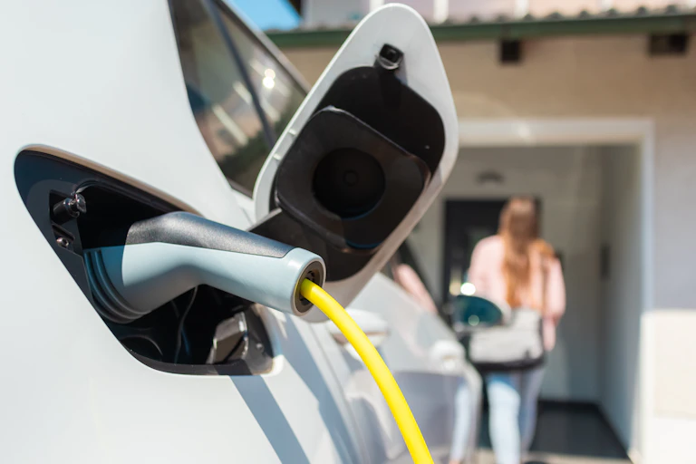 electric car plugged in at home