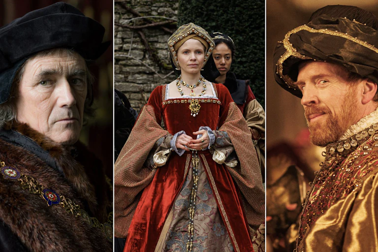 Two men and a woman dressed in Tudor fashions.