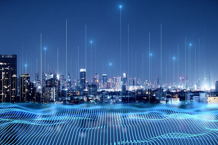 Night time city skyline with digital waves and vertical lines.