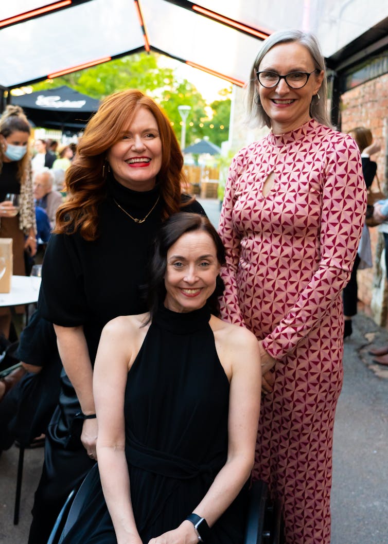 Three smiling women.