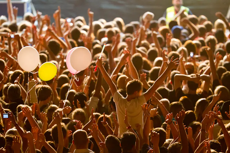 A crowd of young people at a concert.