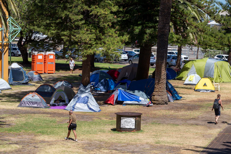 Tents housing homeless people in a public park