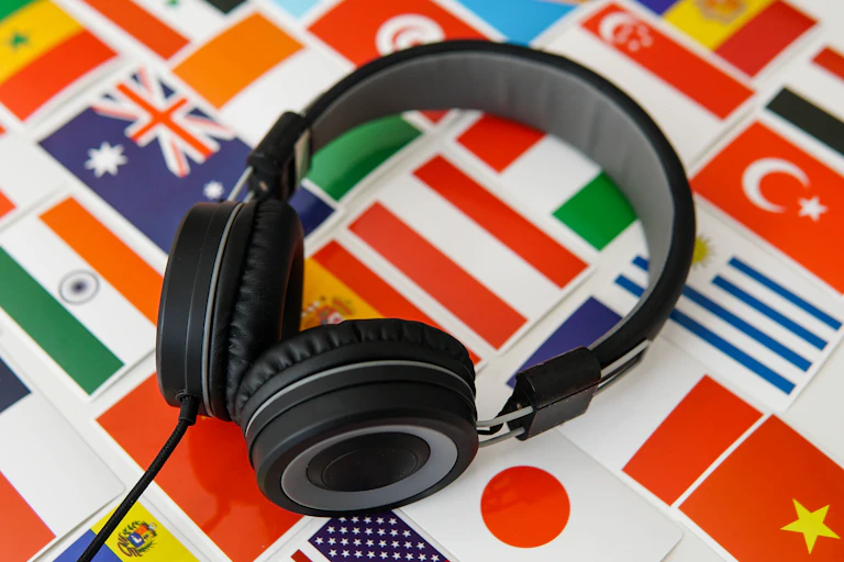 black headphones on colourful pictures of country flags