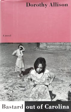 Pink and white book cover featuring a black and white photo of a young girl leaning on a fence and an older woman in the background.