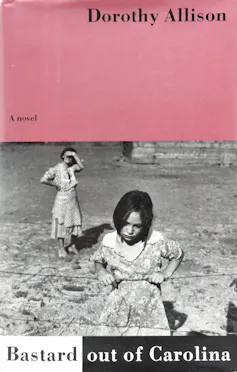Pink and white book cover featuring a black and white photo of a young girl leaning on a fence and an older woman in the background.