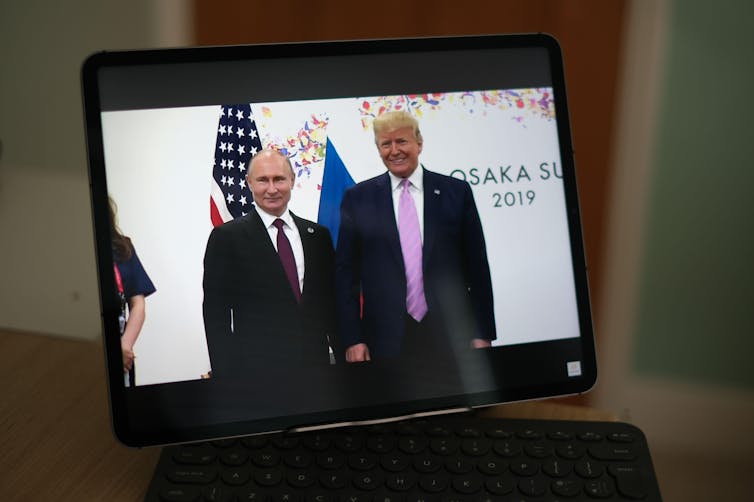 Donald Trump and Vladimir Putin meet at the G20 Summit June 2019.