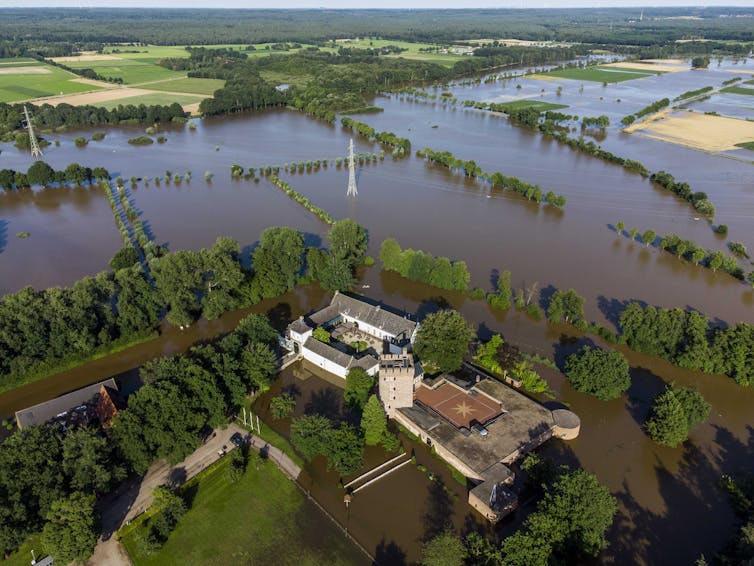 An aerial view of flooded countryside.