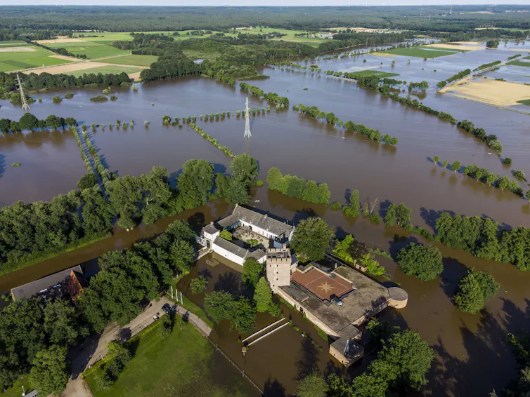 An aerial view of flooded countryside.