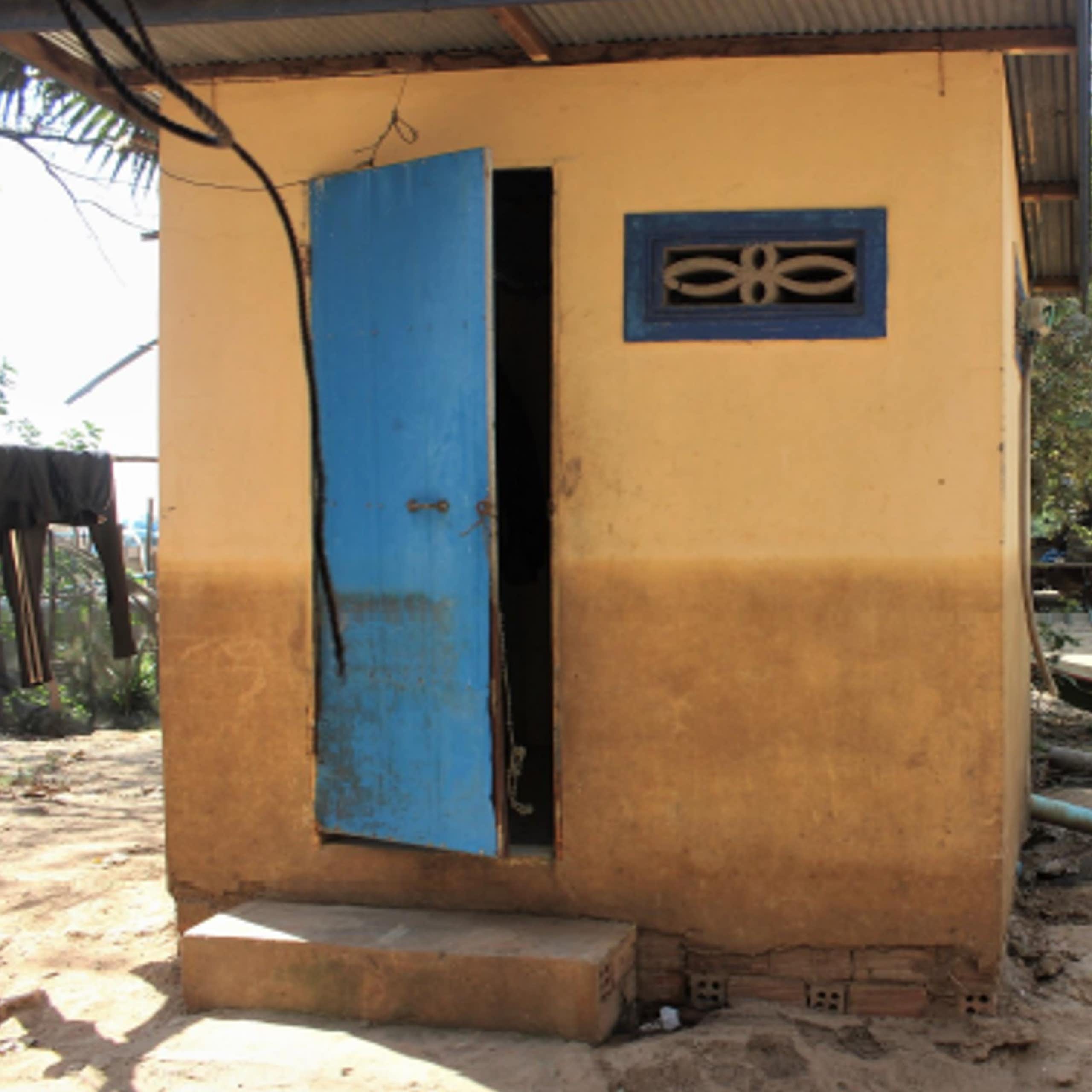 A square building with a high floodwater mark