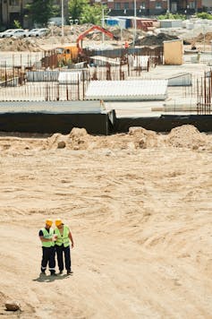 Aerial view of two workers on a construction site