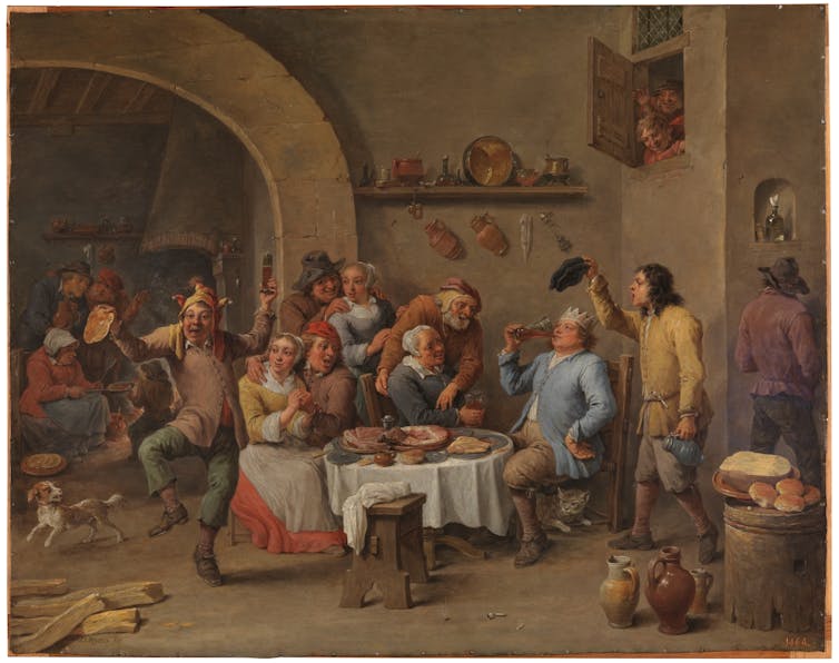 painting of people enjoying an animated feast.