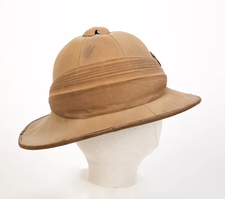 A hat made of a brown material with a flat rim.