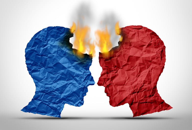 A red head and a blue head crash into each other, sparking flames.