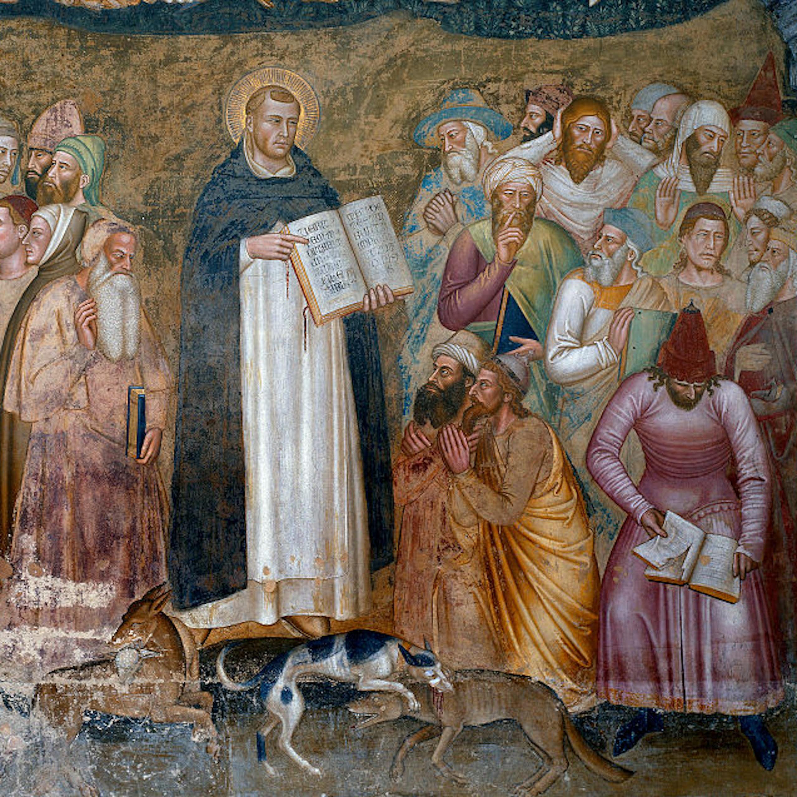 Two men in monk's robes stand a few feet apart, each one talking with a crowd of men in colorful robes.