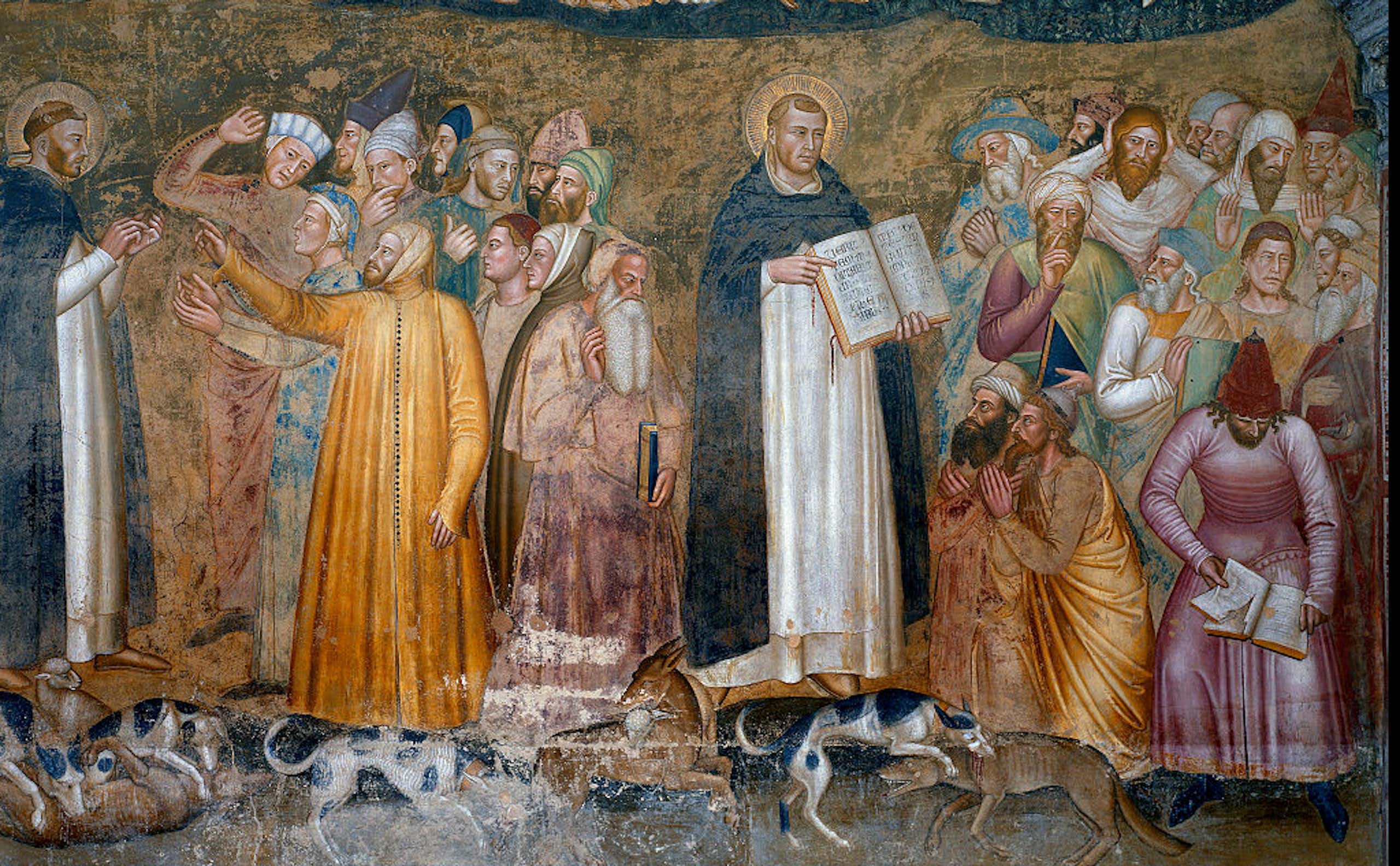 Two men in monk's robes stand a few feet apart, each one talking with a crowd of men in colorful robes.