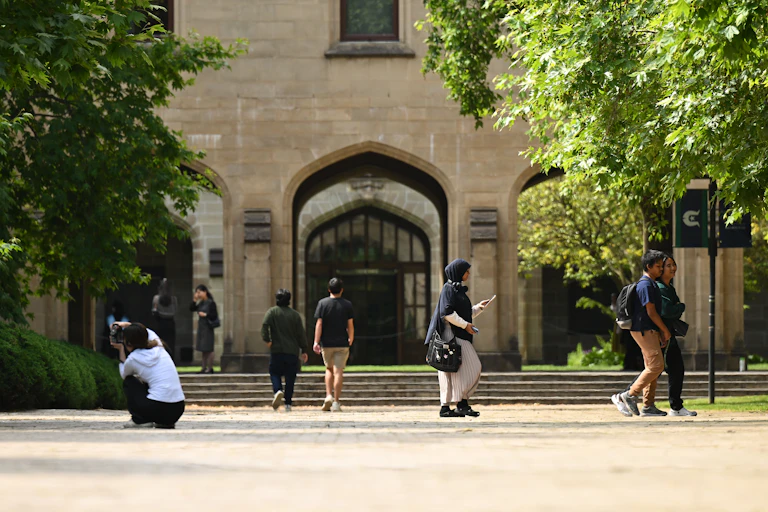 Students on the campus of Melbourne University.