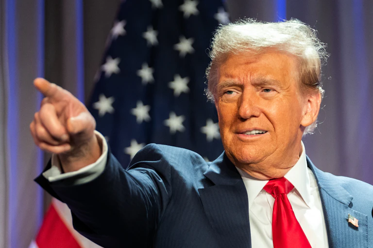 Donald Trump points at something