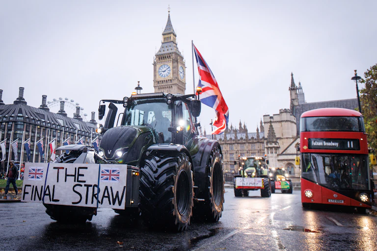 A tractor with a sign reading 'the final straw' in Parliament Square, London.