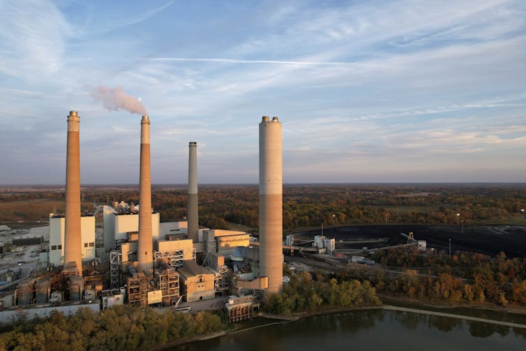 A power plant is seen in the evening light.