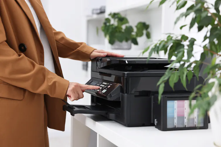 A person at a printer.