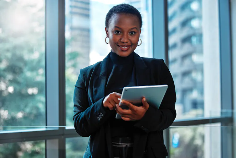 A woman seen with a laptop.