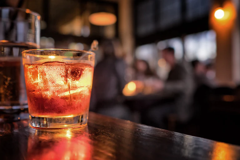 A cocktail on a bar.