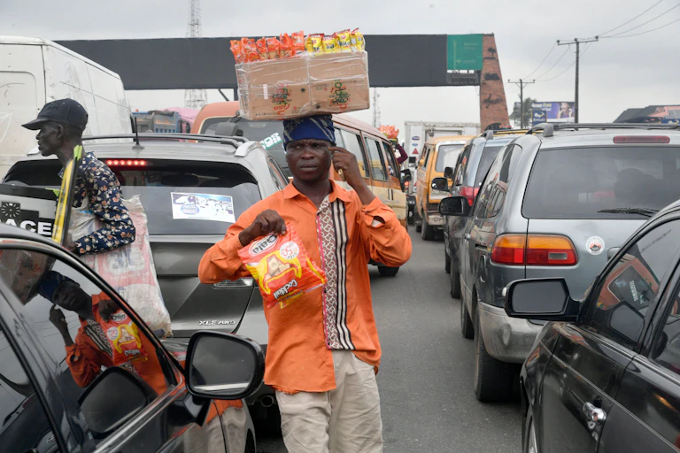 Two men in traffic gridlock
